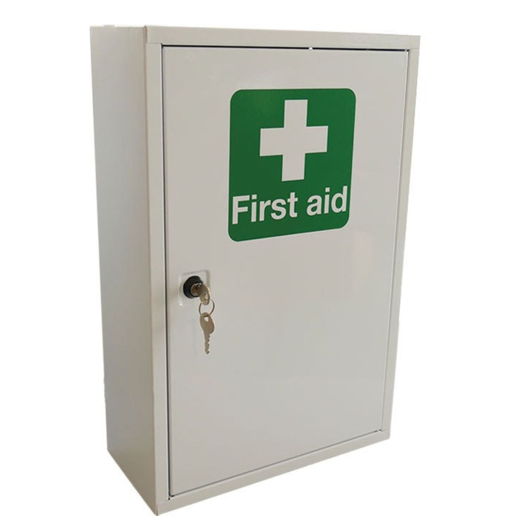 First aid cabinet with a green sign featuring a white cross on a white background