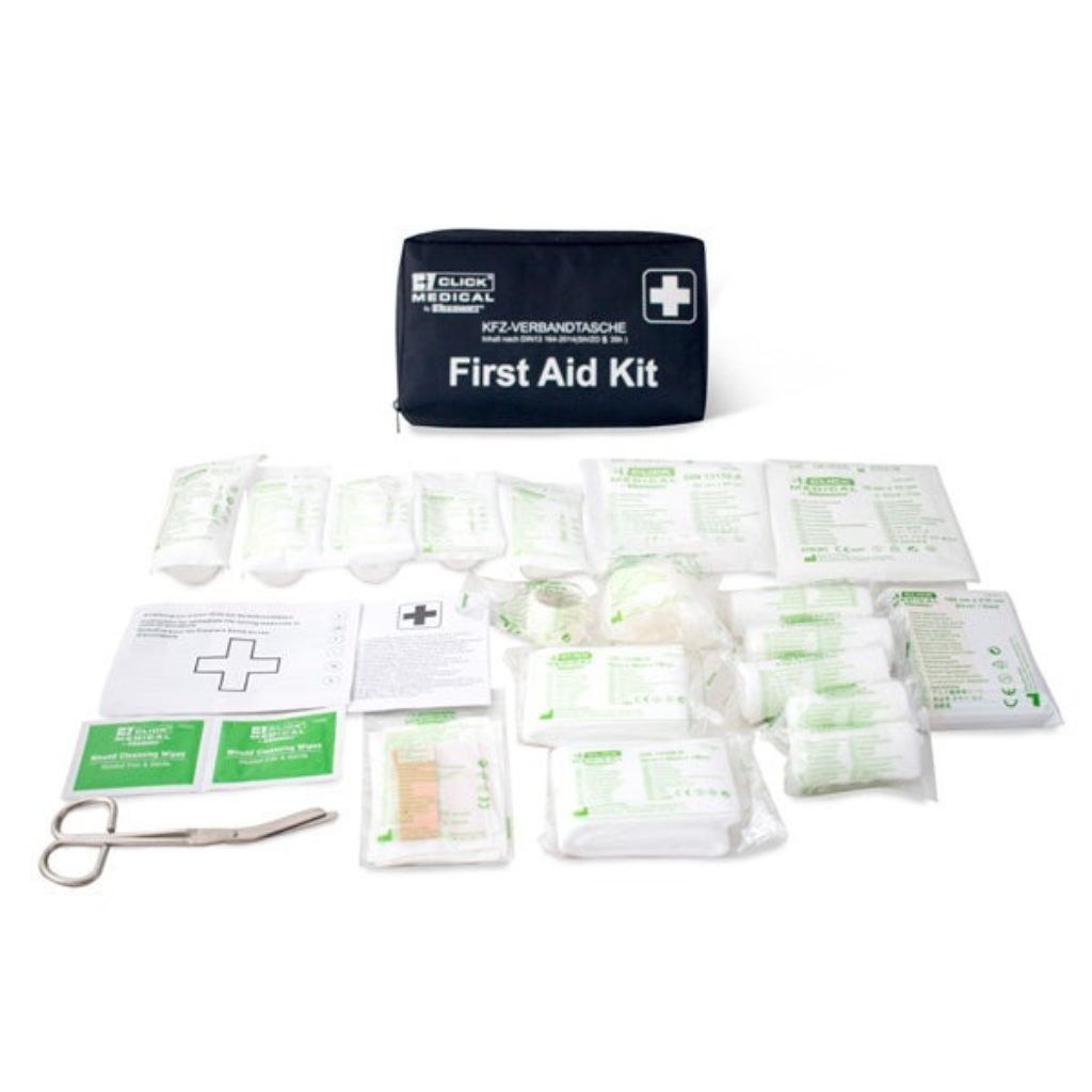 First aid kit with various supplies on a white background